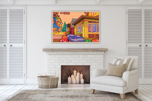 architectural print for sale in warm colors, framed in a living area of a home with white chair. 